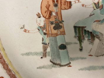 A large Chinese famille verte dish with ladies and boys in a garden, Kangxi
